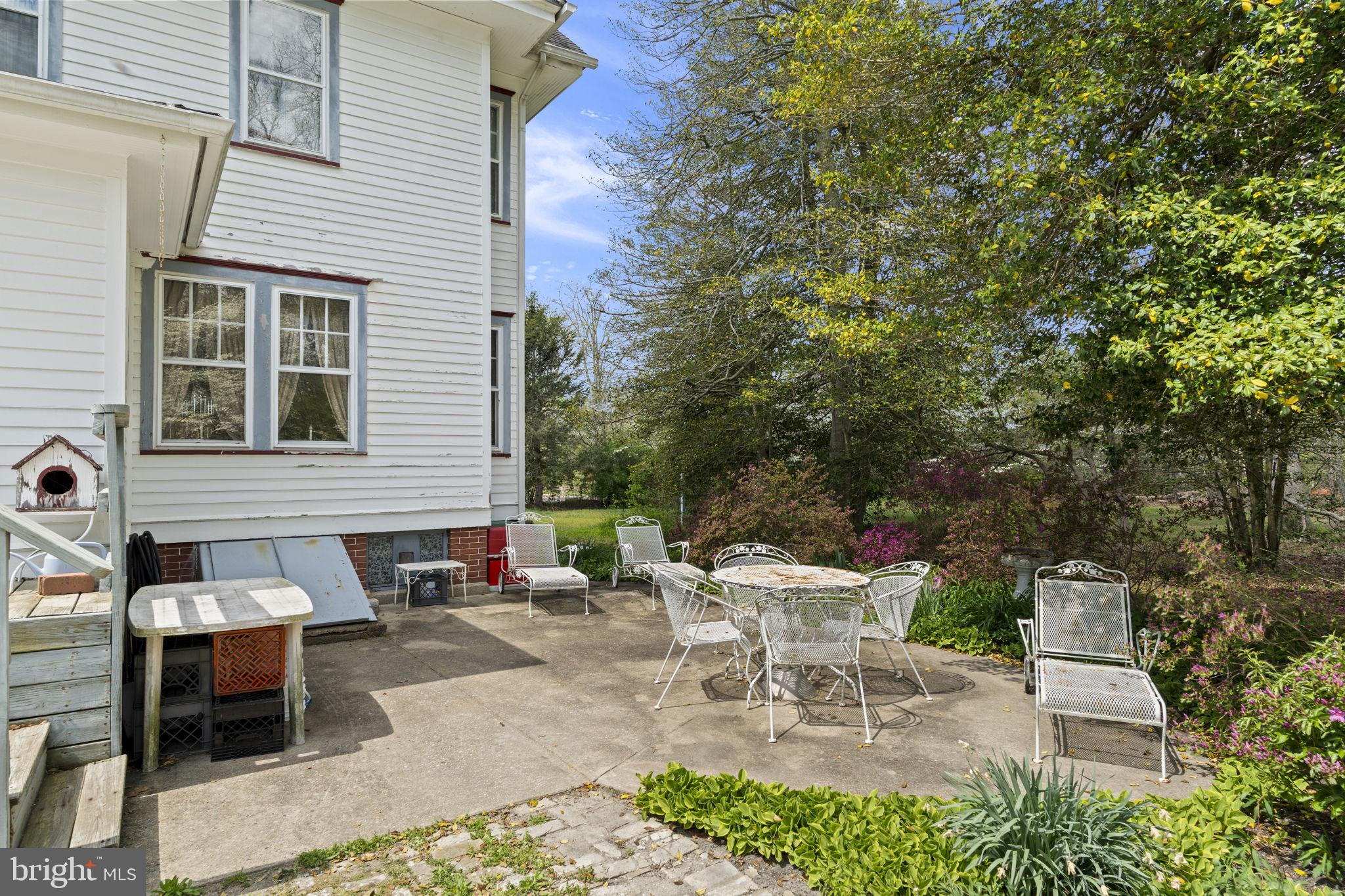 186 South Rte 73 Hammonton, NJ 08037 - Photo 31 of 38 a view of a patio with table and chairs and potted plants