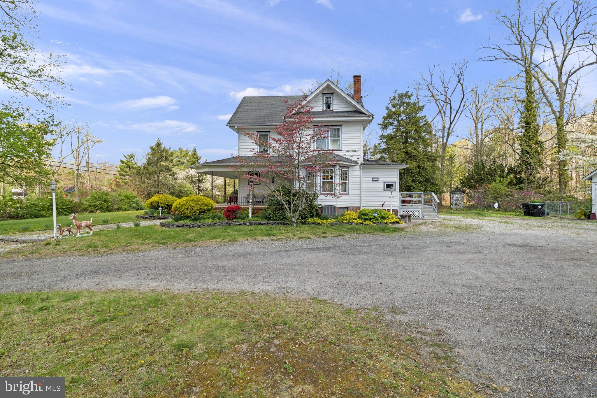 186 South Rte 73 Hammonton, NJ 08037 - Photo 5 of 38 a front view of a house with a yard and trees