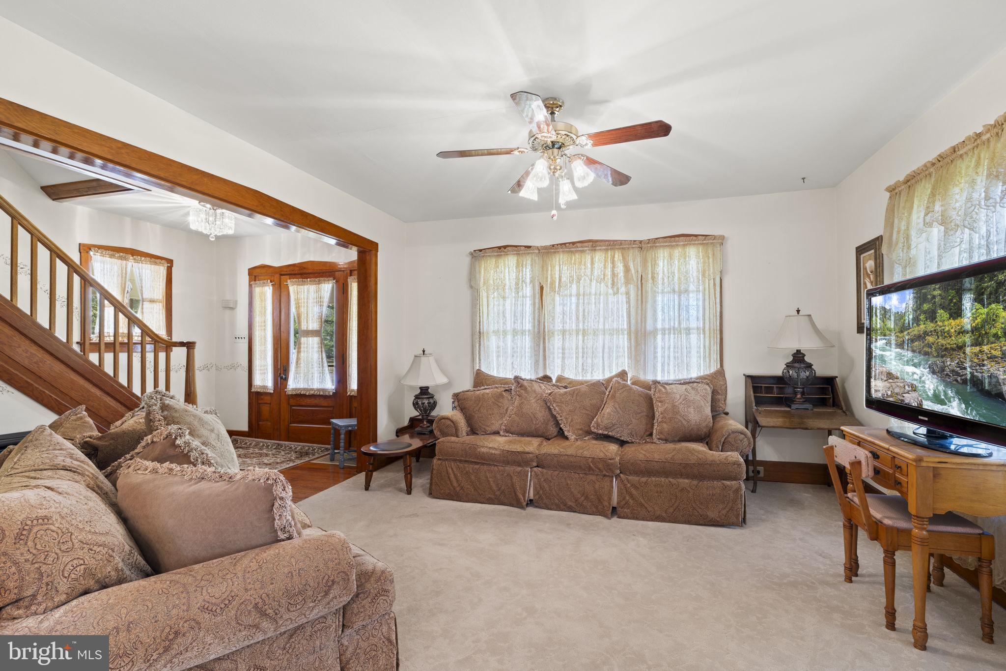 186 South Rte 73 Hammonton, NJ 08037 - Photo 9 of 38 a living room with furniture and a flat screen tv