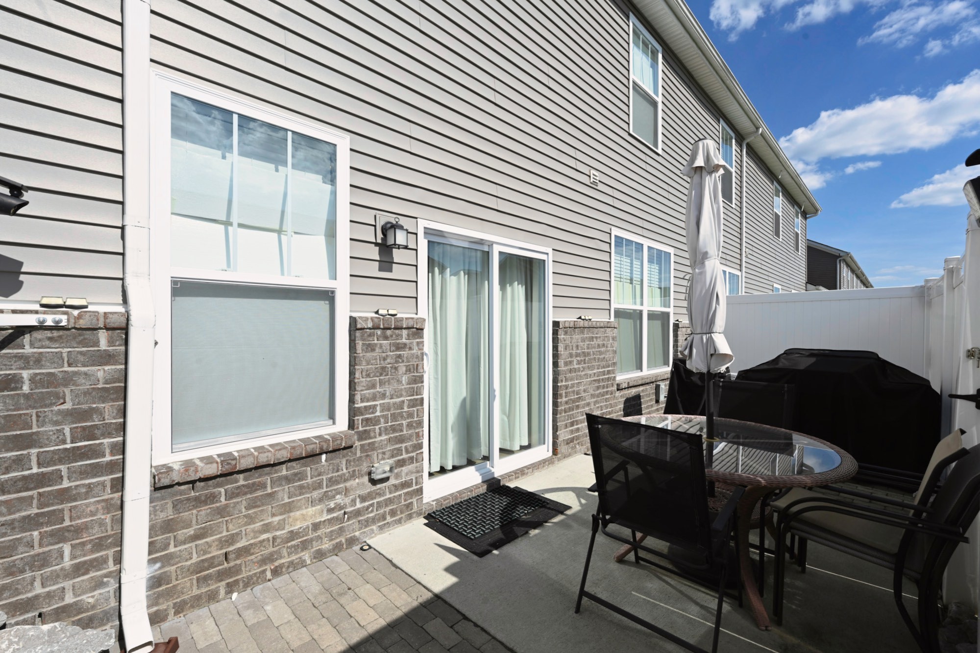 704 Mickelson Way Lebanon, TN 37087 - Photo 31 of 38 a view of a patio with a table and chairs and a barbeque