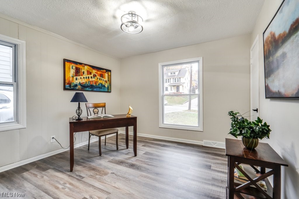 1596 Sheffield Road Cleveland, OH 44121 - Photo 20 of 35 Office with a textured ceiling and wood-type flooring