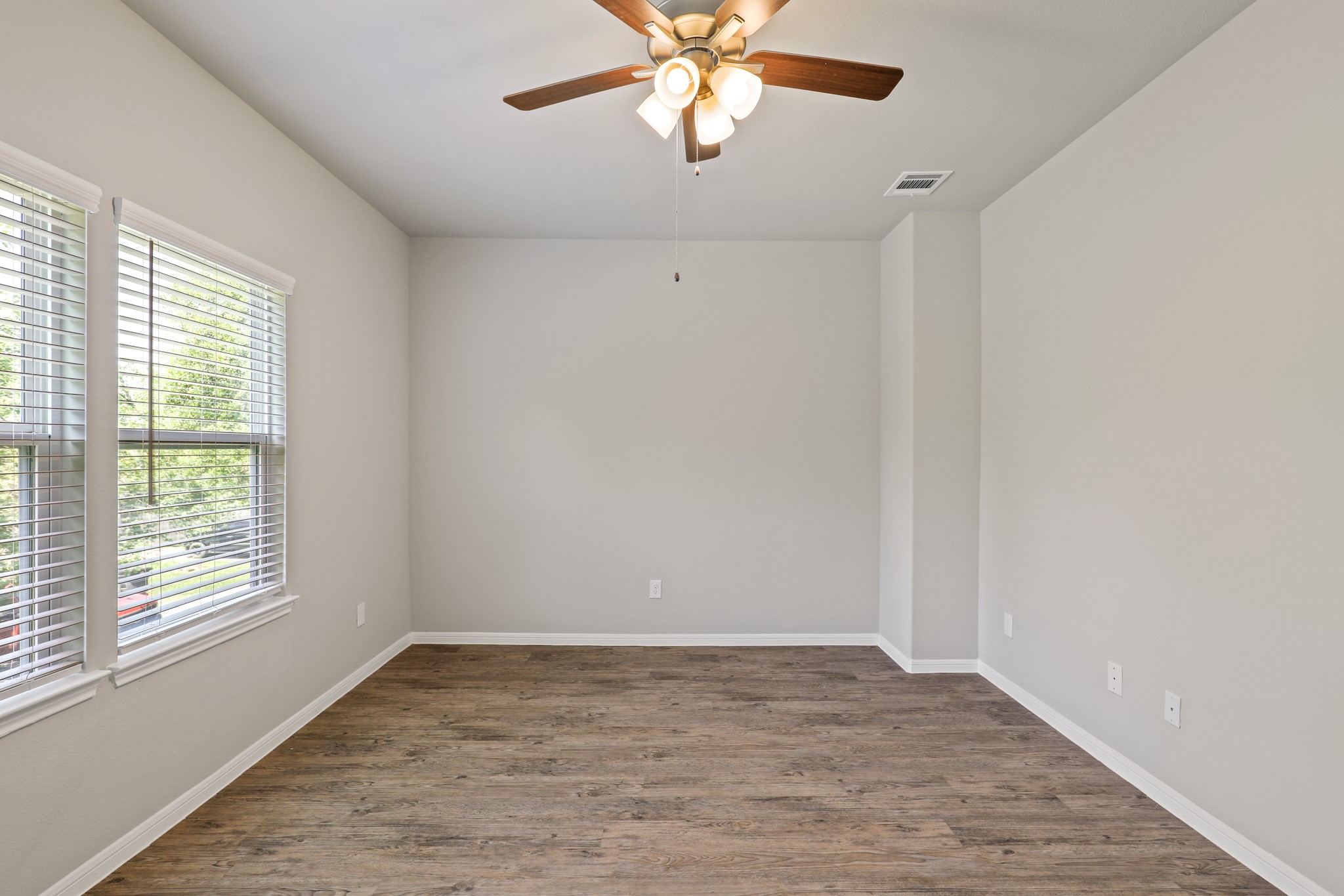 13502 Axel Lane Houston, TX 77047 - Photo 22 of 34 wooden floor in an empty room with a window
