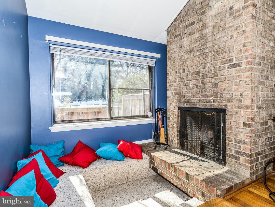 11974 Greywing Court Reston, VA 20191 - Photo 4 of 21 Conversation pit around wood burning fireplace