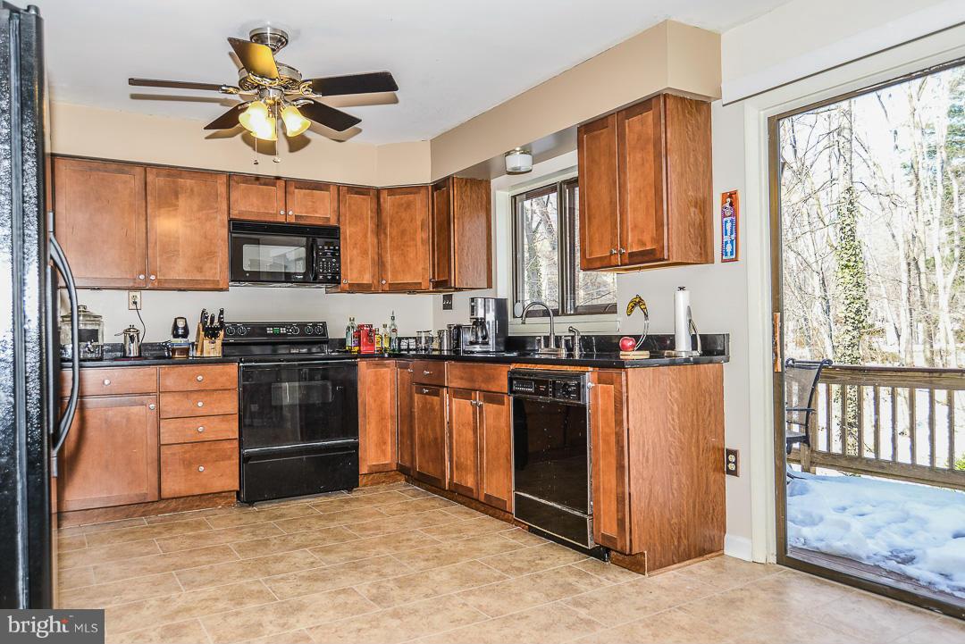 11974 Greywing Court Reston, VA 20191 - Photo 9 of 21 Kitchen with sliding glass doors leading to deck