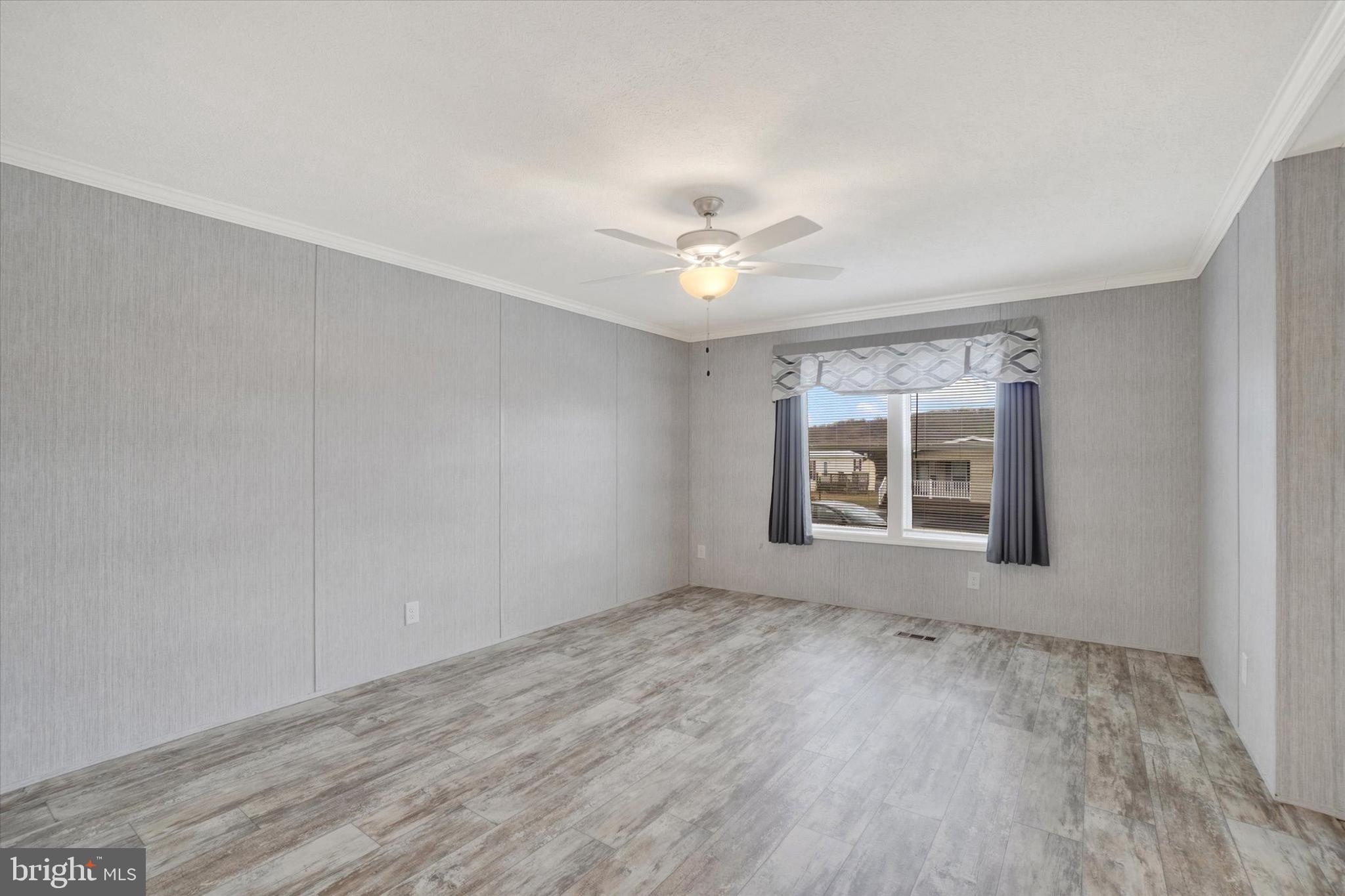 208 Country Ridge Drive York, PA 17408 - Photo 12 of 26 an empty room with wooden floor and windows