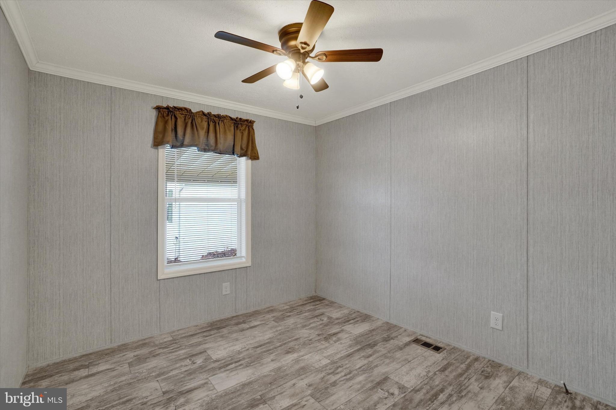 208 Country Ridge Drive York, PA 17408 - Photo 16 of 26 wooden floor in an empty room with a window