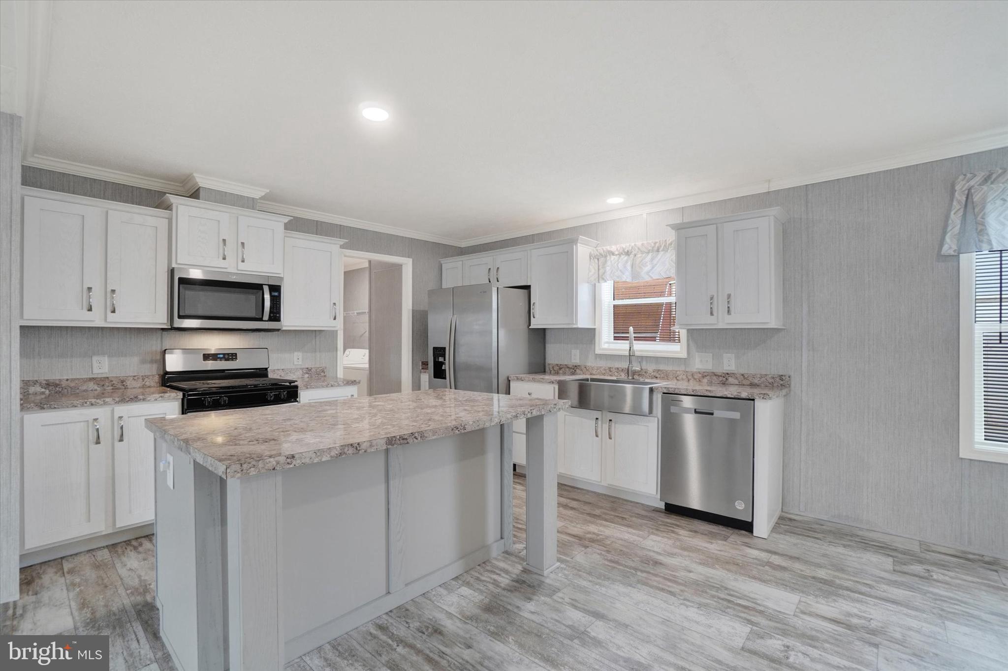 208 Country Ridge Drive York, PA 17408 - Photo 9 of 26 a kitchen with white cabinets appliances and sink