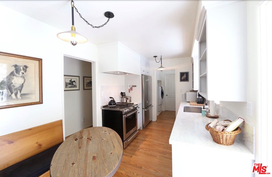 16948 Bollinger Drive Pacific Palisades, CA 90272 - Photo 4 of 5 a living room with furniture