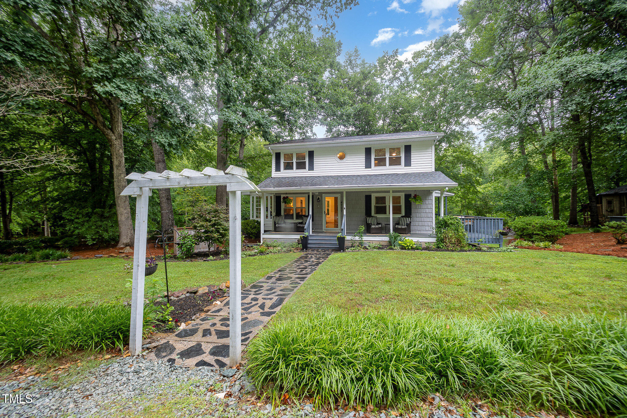 4777 Helena Moriah Road Rougemont, NC 27572 - Photo 1 of 41 a front view of a house with a yard table and chairs