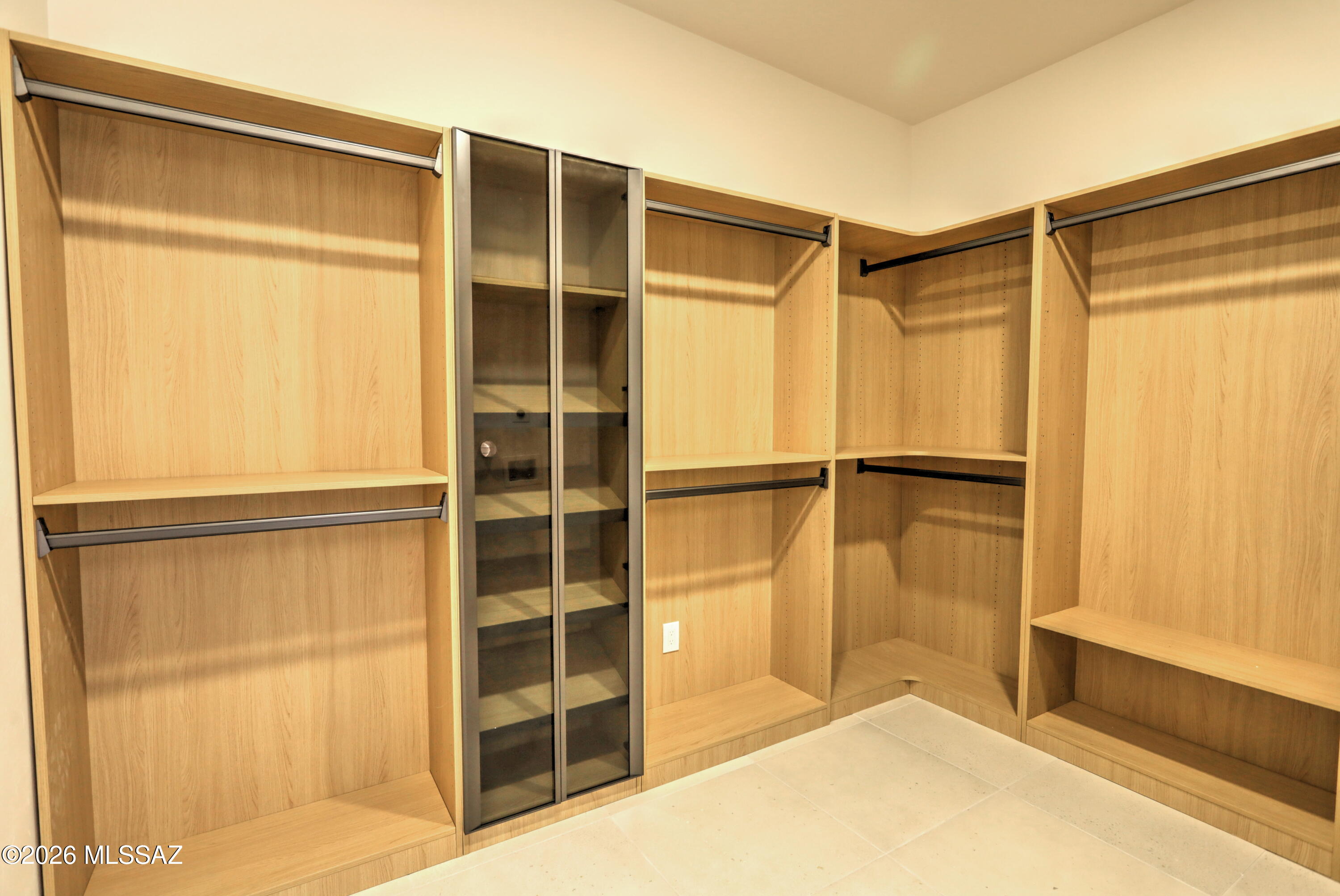 4939 East River Road Tucson, AZ 85718 - Photo 18 of 29 a view of closet area with empty racks