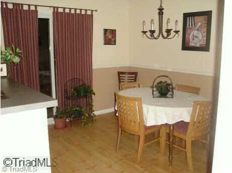5733 H Bramblegate Road, Unit H Greensboro, NC 27409 - Photo 4 of 9 Other. Dining room with sliding glass doors to patio.