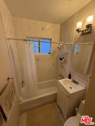 a bathroom with a sink and shower