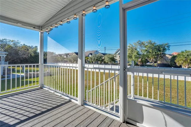 a view of a balcony with wooden floor