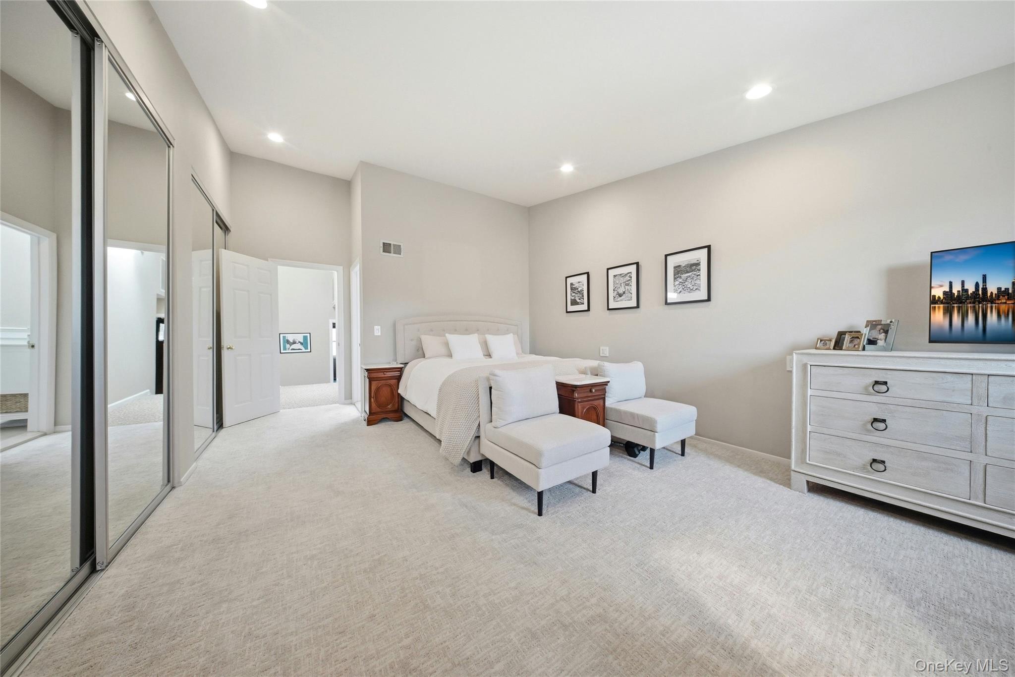 78 Hidden Ridge Drive Syosset, NY 11791 - Photo 12 of 21 a bed room with a bed and a dresser