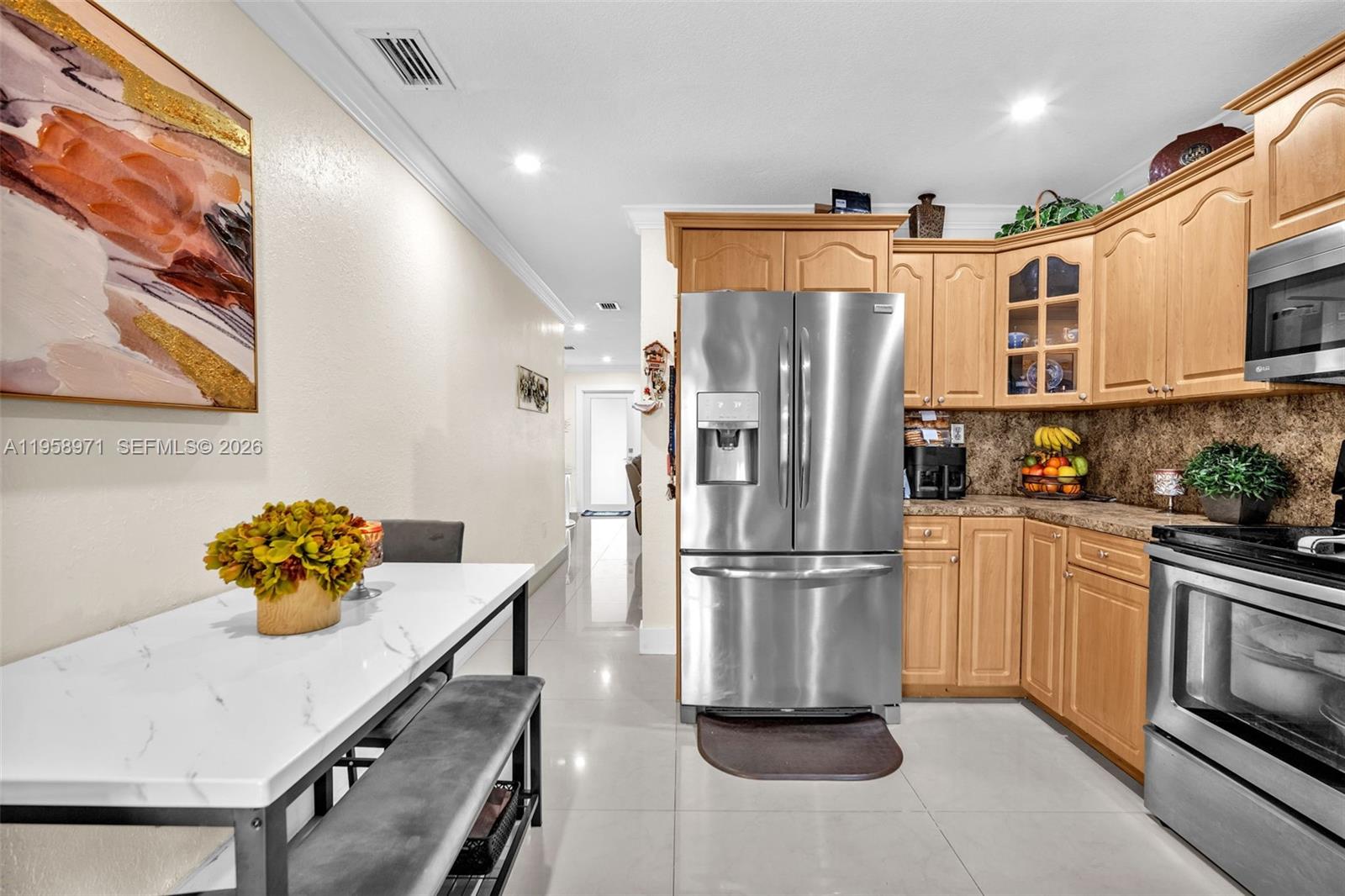 11245 Southwest 155th Lane Miami, FL 33157 - Photo 11 of 30 a kitchen with stainless steel appliances a refrigerator sink and cabinets