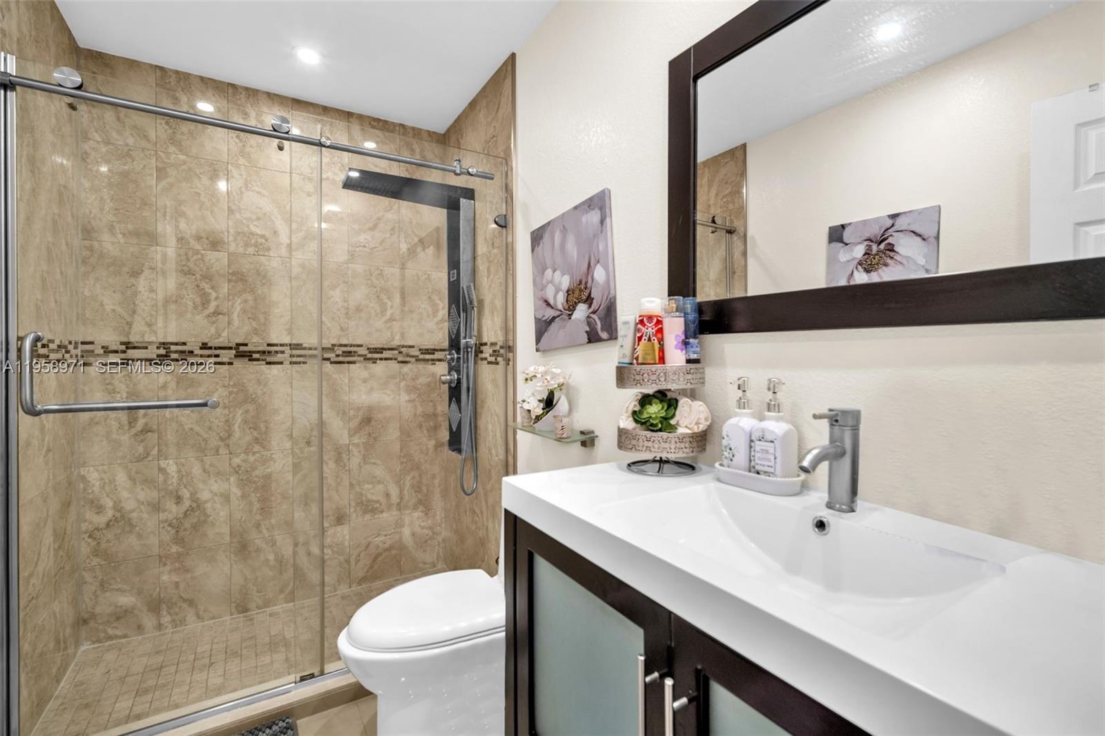 11245 Southwest 155th Lane Miami, FL 33157 - Photo 14 of 30 a bathroom with a sink toilet and shower