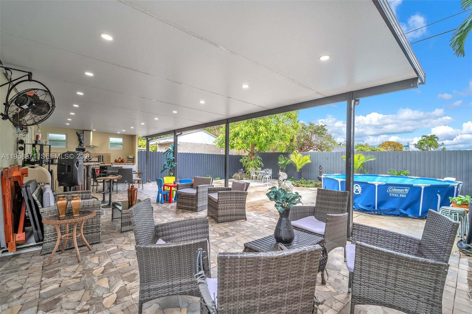 11245 Southwest 155th Lane Miami, FL 33157 - Photo 23 of 30 a living room with fireplace furniture and a large window