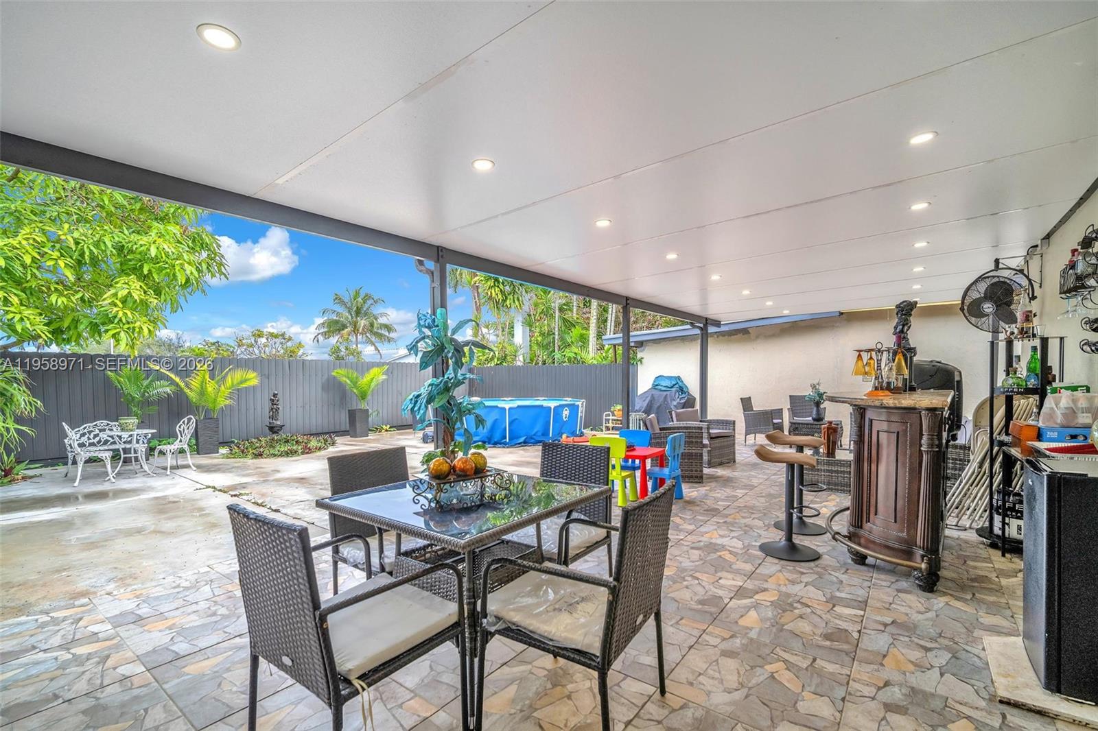 11245 Southwest 155th Lane Miami, FL 33157 - Photo 26 of 30 a view of a dining room with furniture and a potted plant