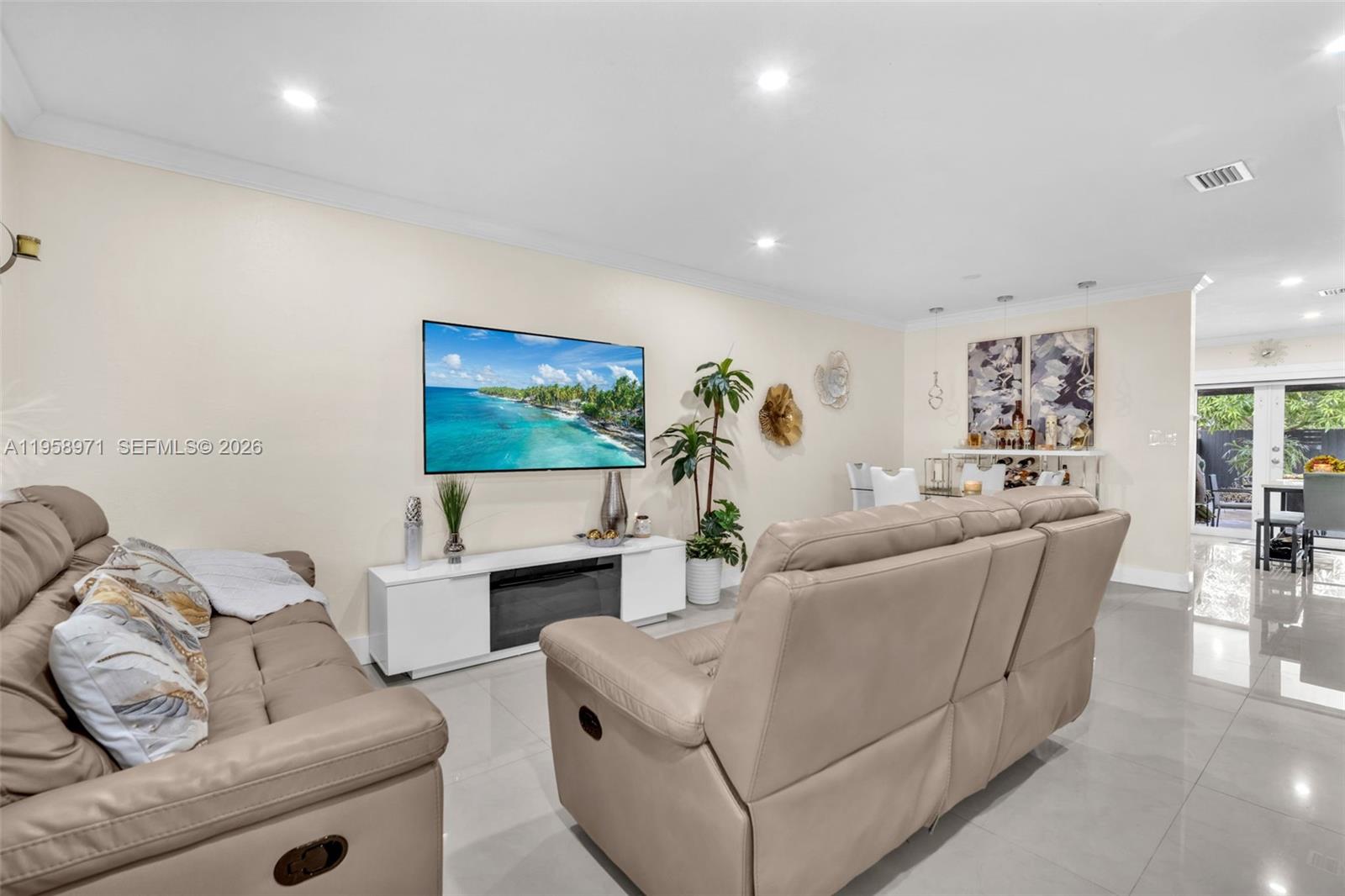 11245 Southwest 155th Lane Miami, FL 33157 - Photo 8 of 30 a living room with furniture and a flat screen tv