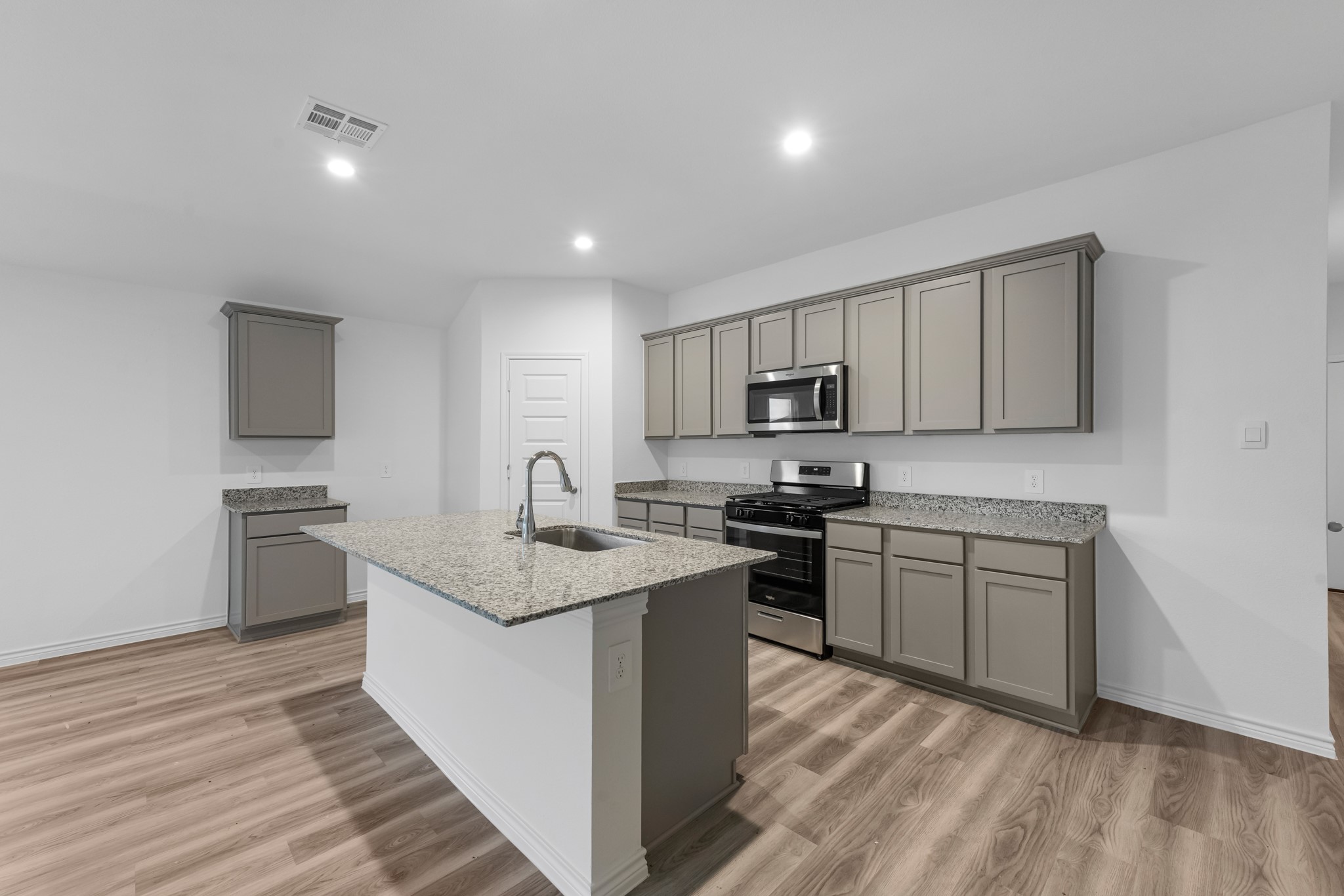 5650 Spoonbill Orange, TX 77632 - Photo 6 of 26 a kitchen with a sink stove top oven and refrigerator
