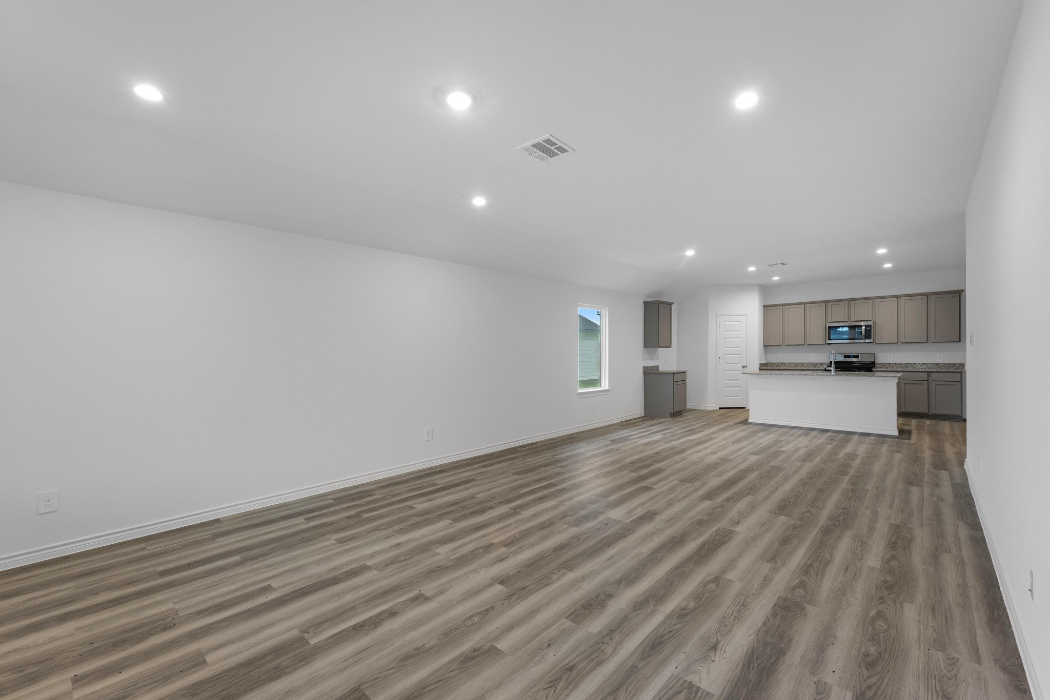 5650 Spoonbill Orange, TX 77632 - Photo 8 of 26 a view of empty room with wooden floor