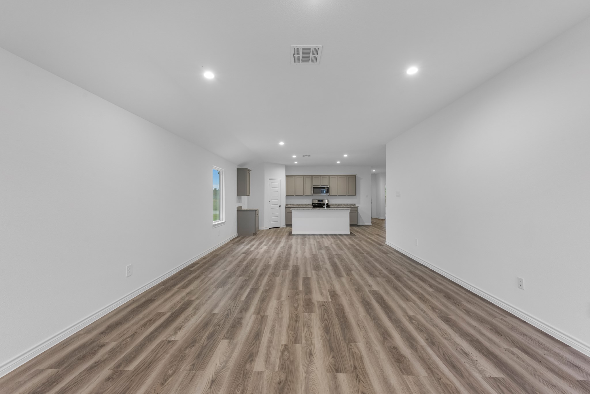 5650 Spoonbill Orange, TX 77632 - Photo 9 of 26 a view of a room with wooden floor