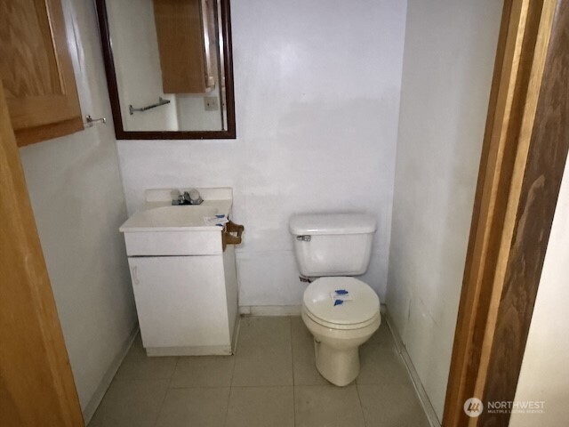 314 Liberty Avenue Granger, WA 98932 - Photo 24 of 26 a white toilet sitting next to a bathroom sink