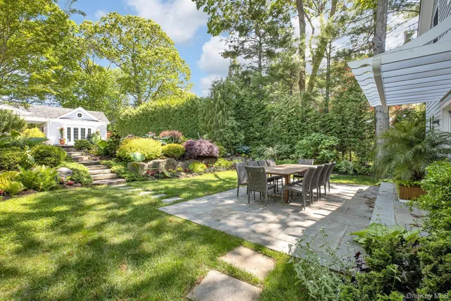 a view of a table and chairs in the garden