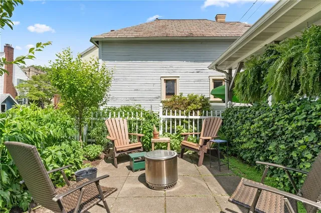 a view of a house with roof deck front of house