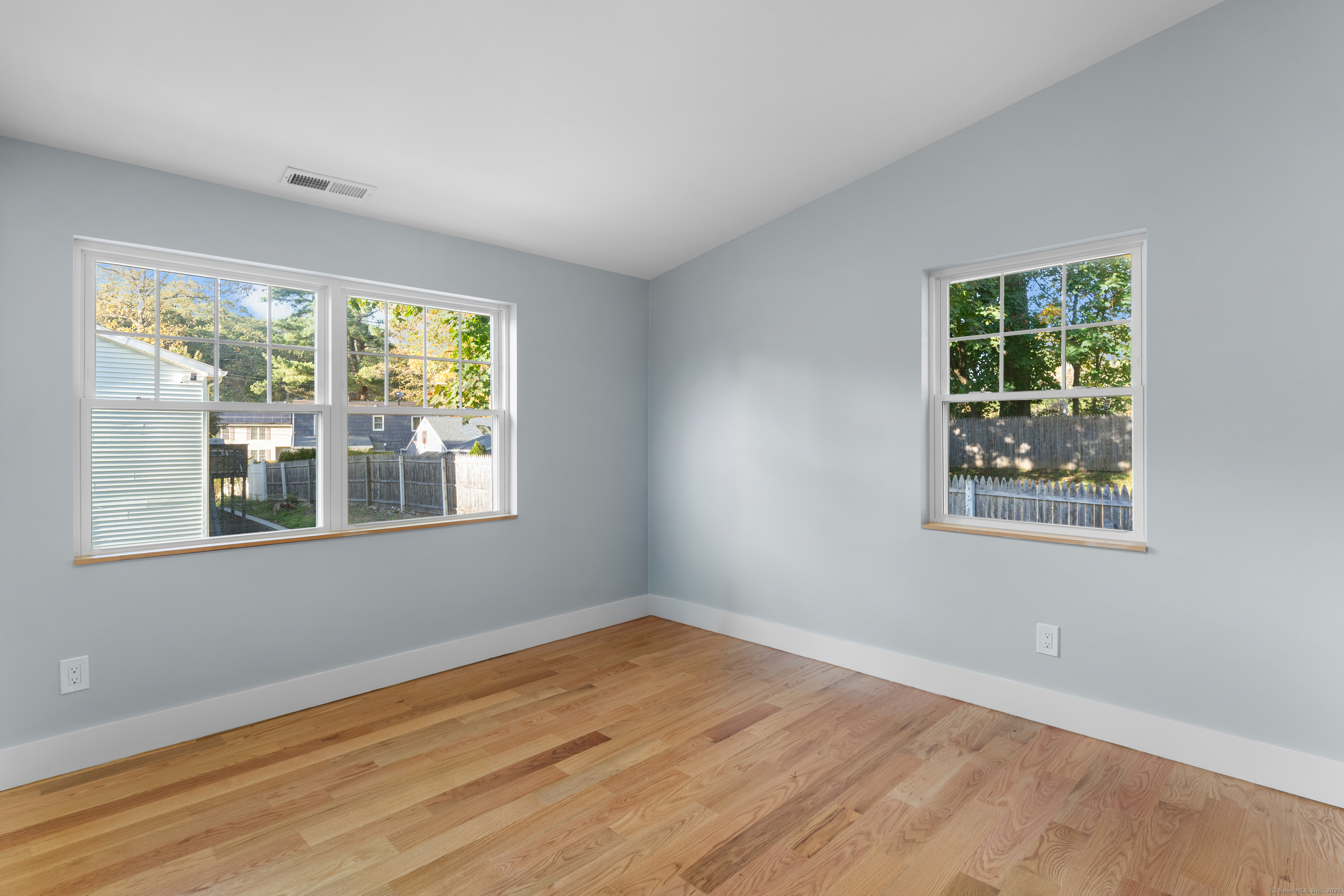 123 Exeter Street Bridgeport, CT 06606 - Photo 14 of 26 a view of an empty room with wooden floor and a window