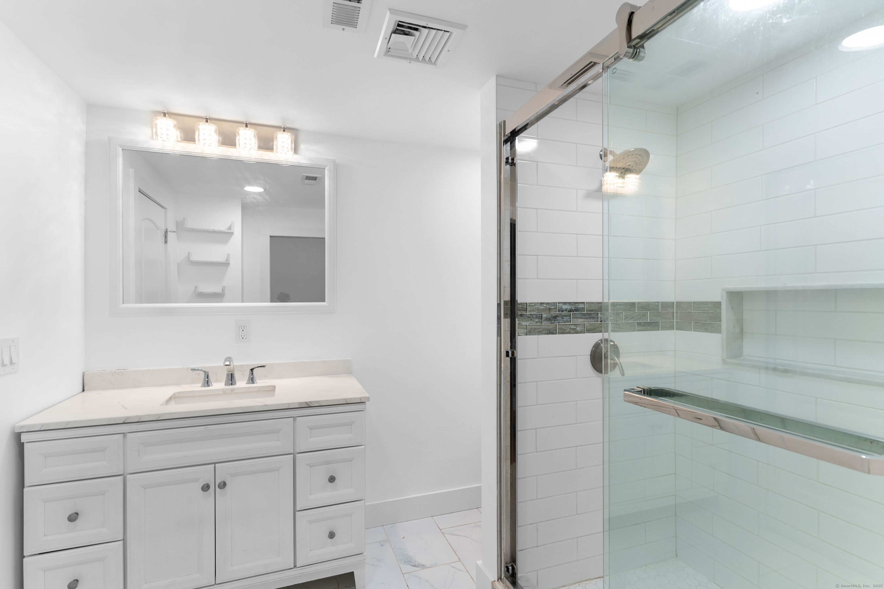 123 Exeter Street Bridgeport, CT 06606 - Photo 17 of 26 a bathroom with a sink and a mirror