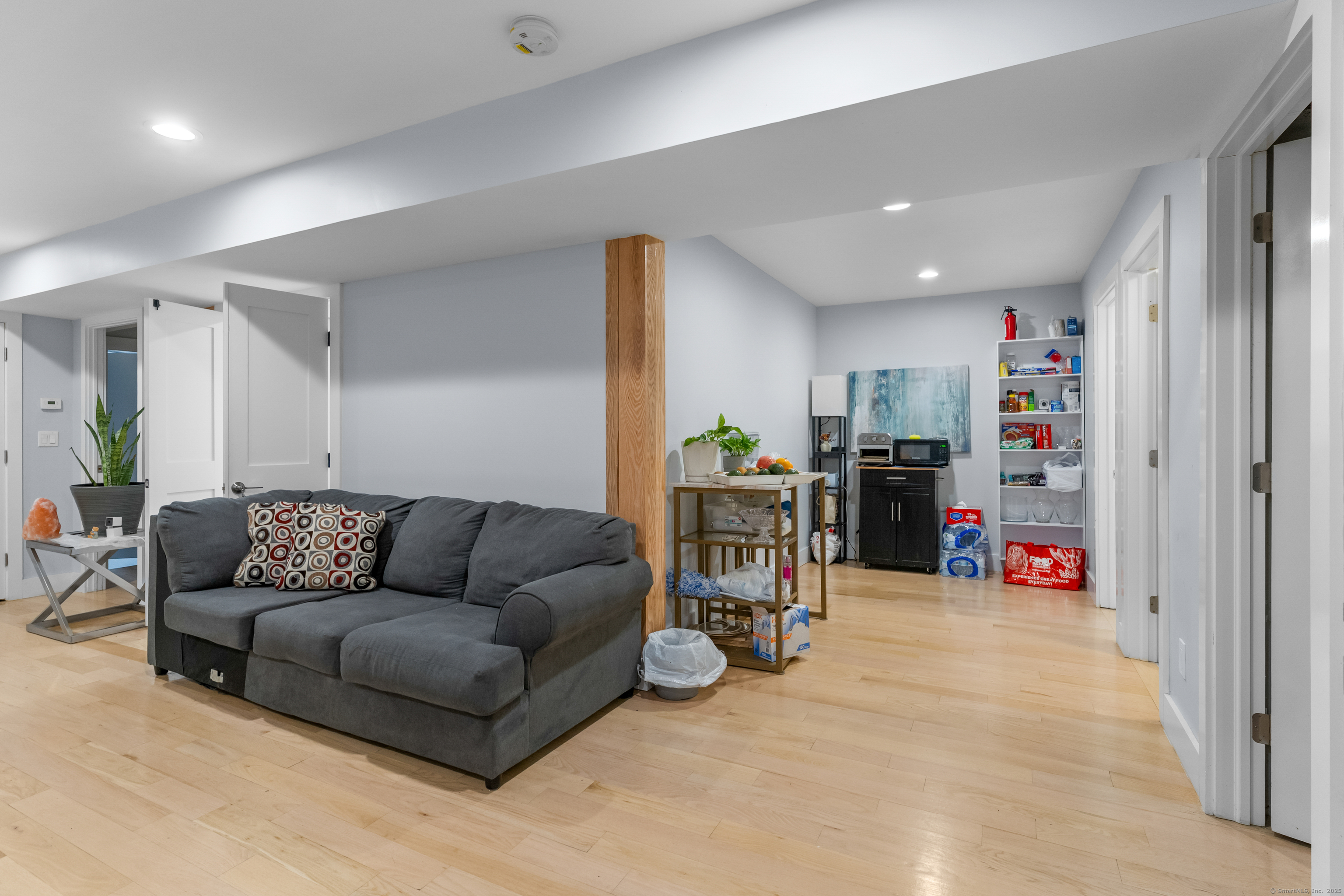123 Exeter Street Bridgeport, CT 06606 - Photo 22 of 26 a living room with furniture and a book shelf