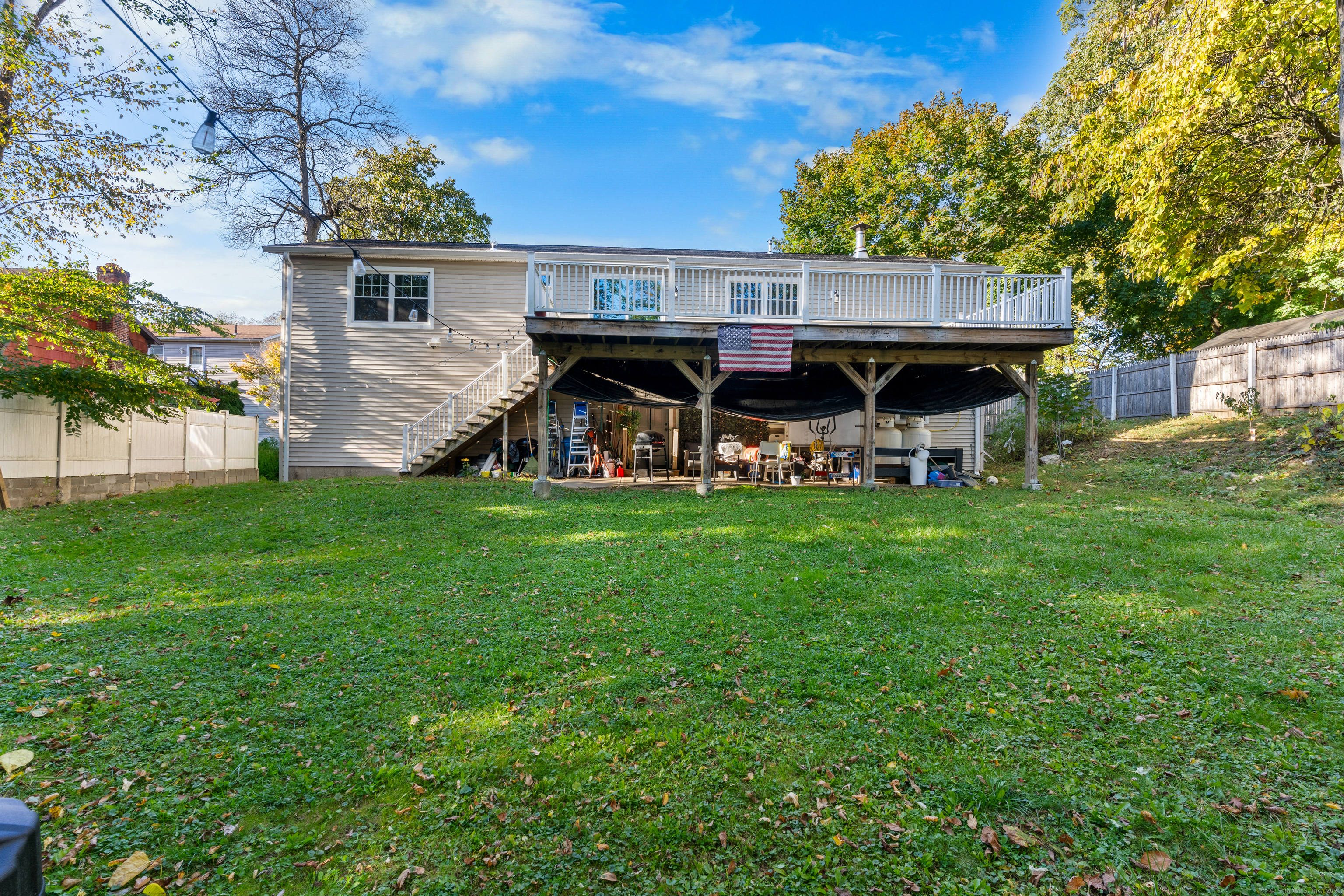 123 Exeter Street Bridgeport, CT 06606 - Photo 3 of 26 a view of a house with a yard deck and sitting area