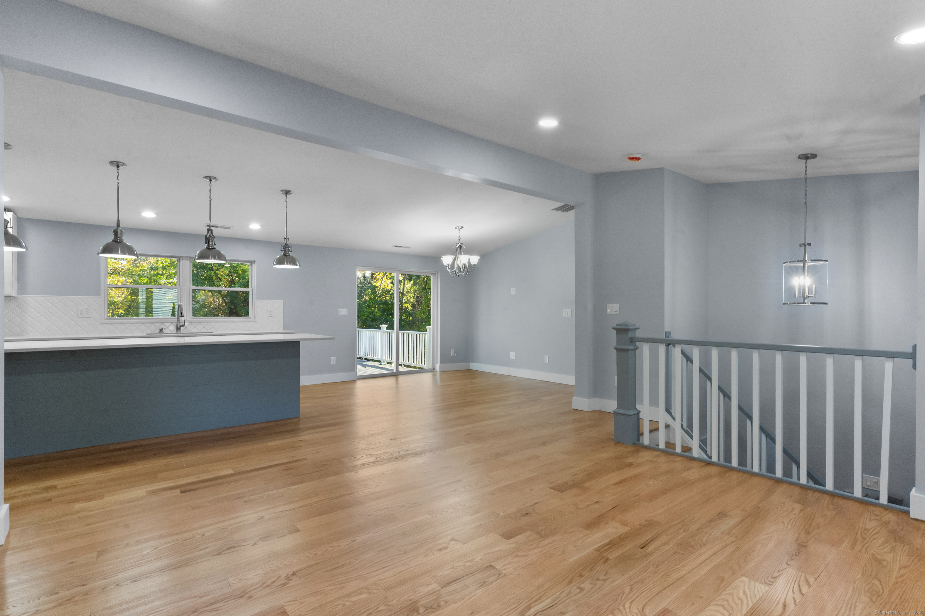 123 Exeter Street Bridgeport, CT 06606 - Photo 6 of 26 a view of an empty room with a window and wooden floor
