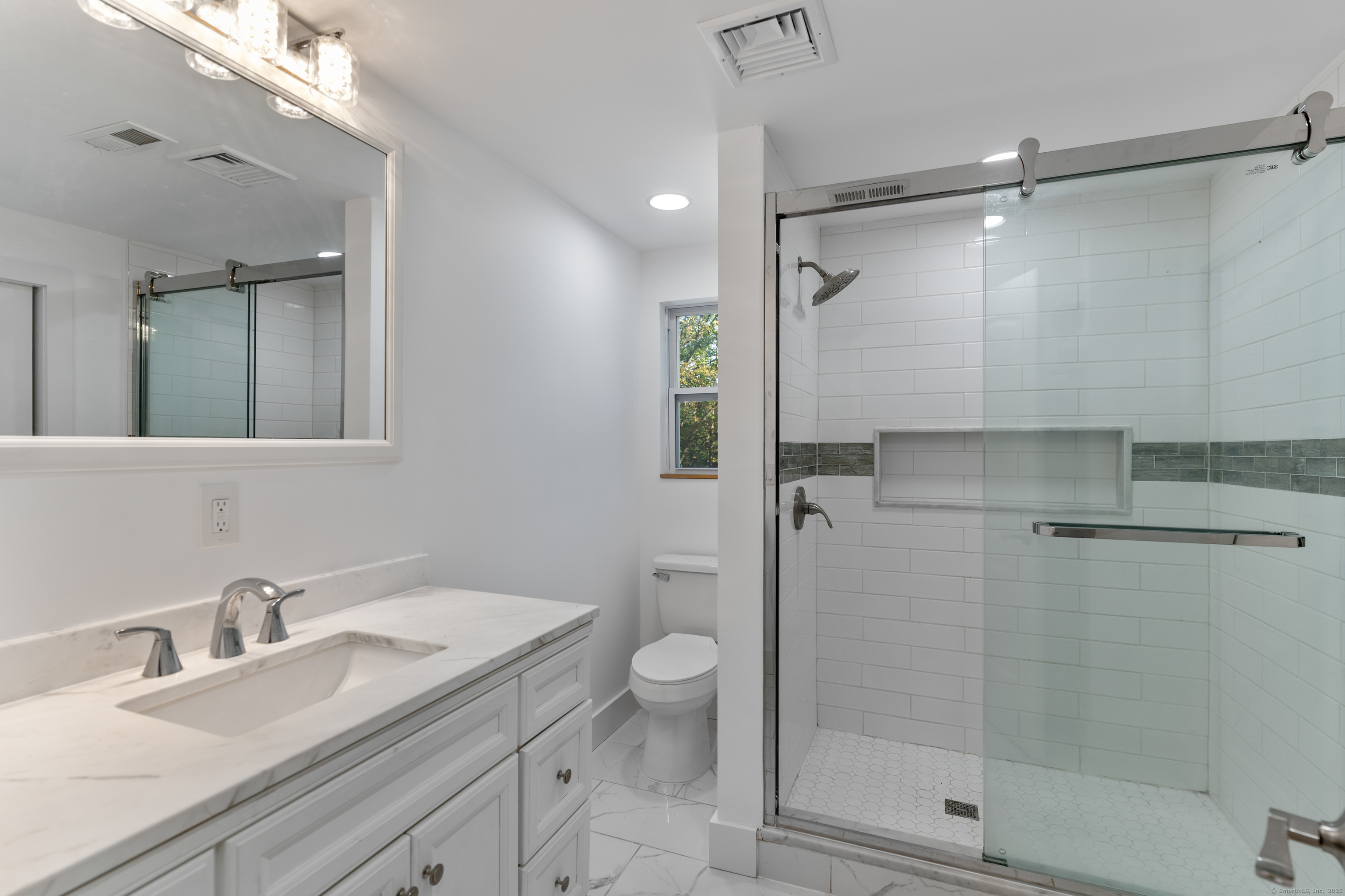 123 Exeter Street Bridgeport, CT 06606 - Photo 9 of 26 a bathroom with a granite countertop sink toilet and shower