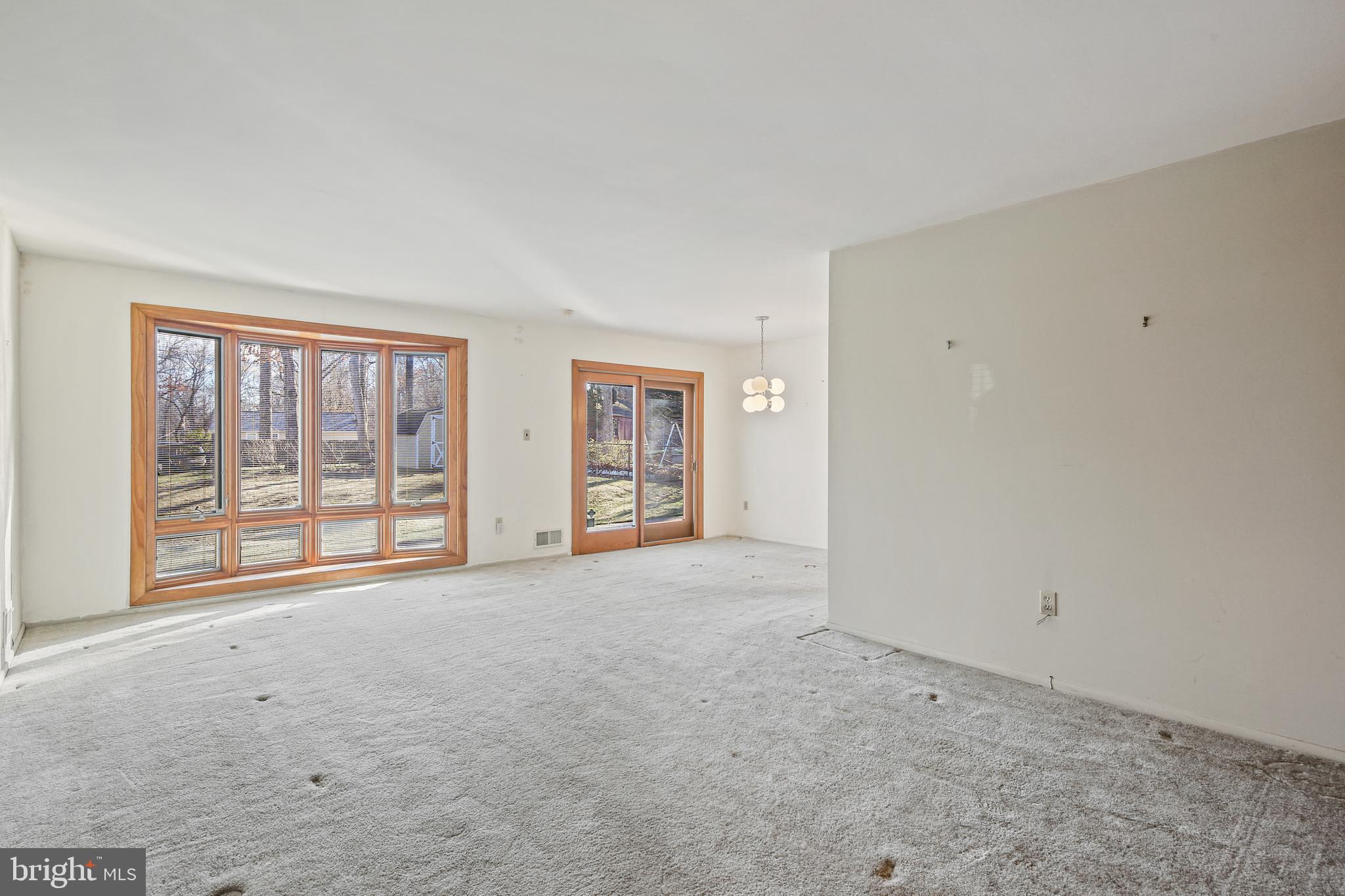 6215 Roblynn Road Laurel, MD 20707 - Photo 2 of 38 an empty room with windows