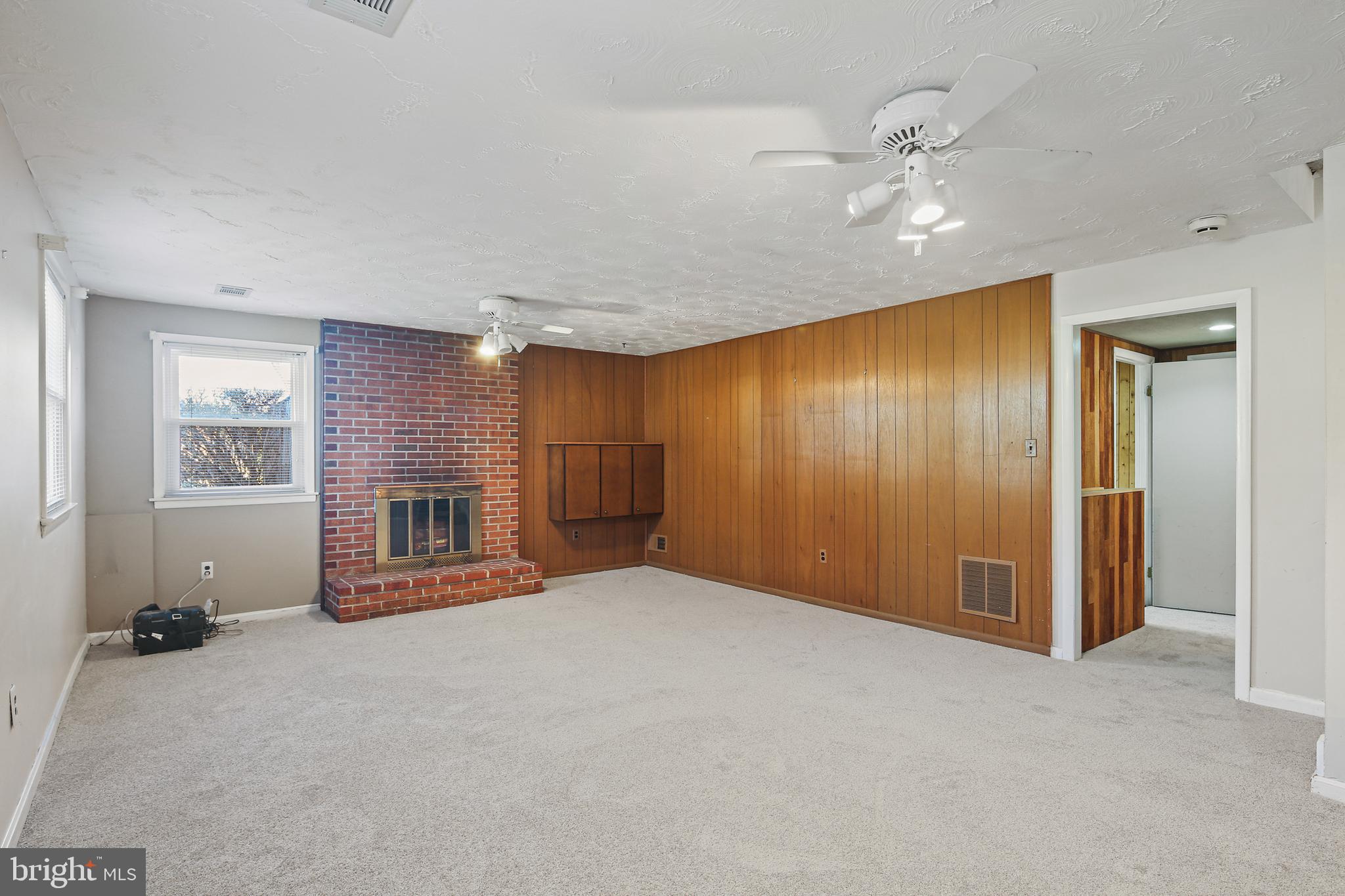 6215 Roblynn Road Laurel, MD 20707 - Photo 25 of 38 a view of an empty room with a fireplace