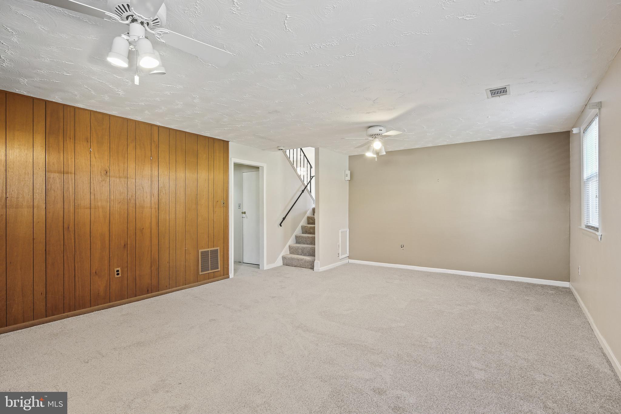6215 Roblynn Road Laurel, MD 20707 - Photo 26 of 38 an empty room with a ceiling fan and closet area