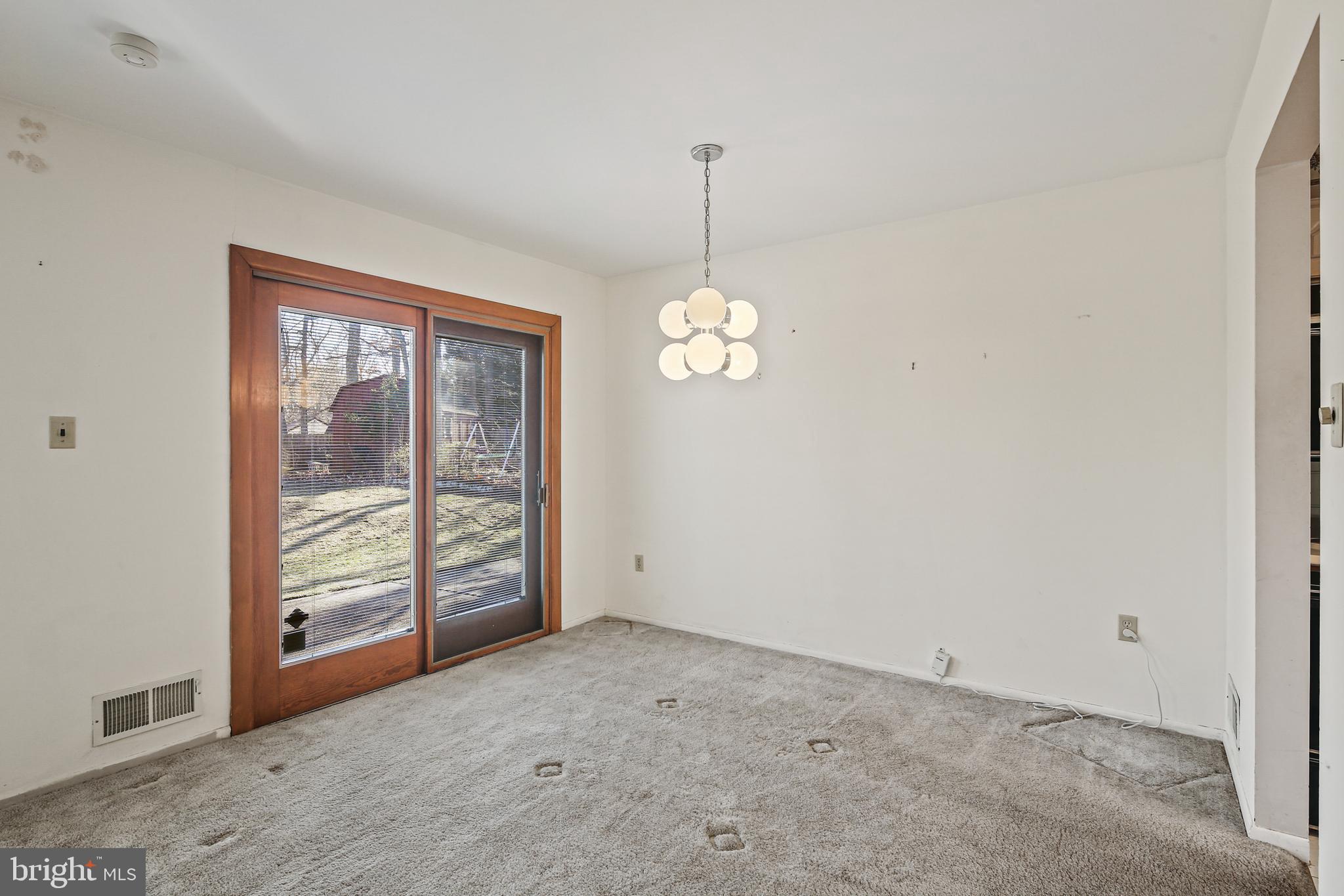 6215 Roblynn Road Laurel, MD 20707 - Photo 3 of 38 a view of an empty room with a window