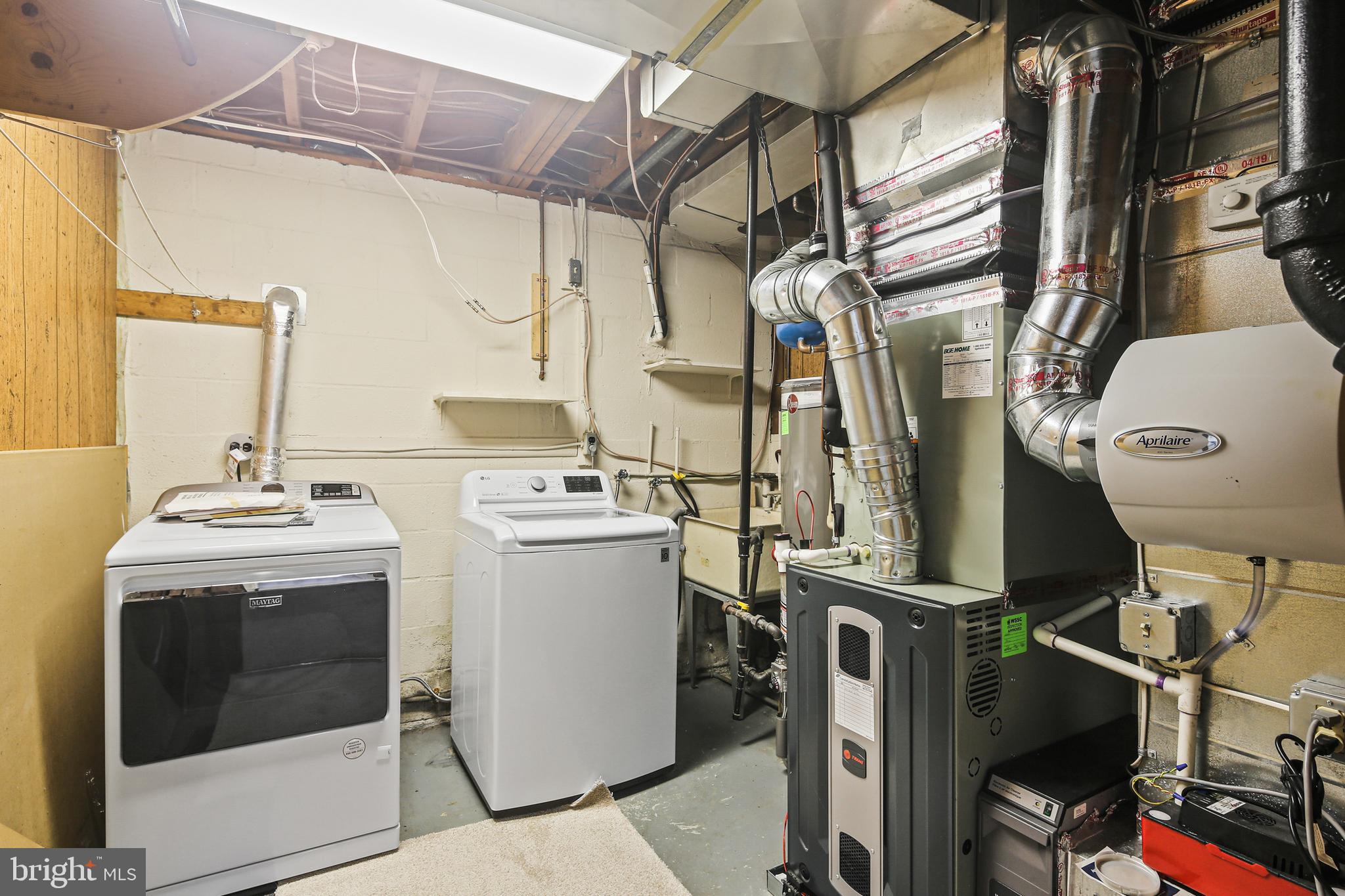 6215 Roblynn Road Laurel, MD 20707 - Photo 31 of 38 a utility room with dryer and washer