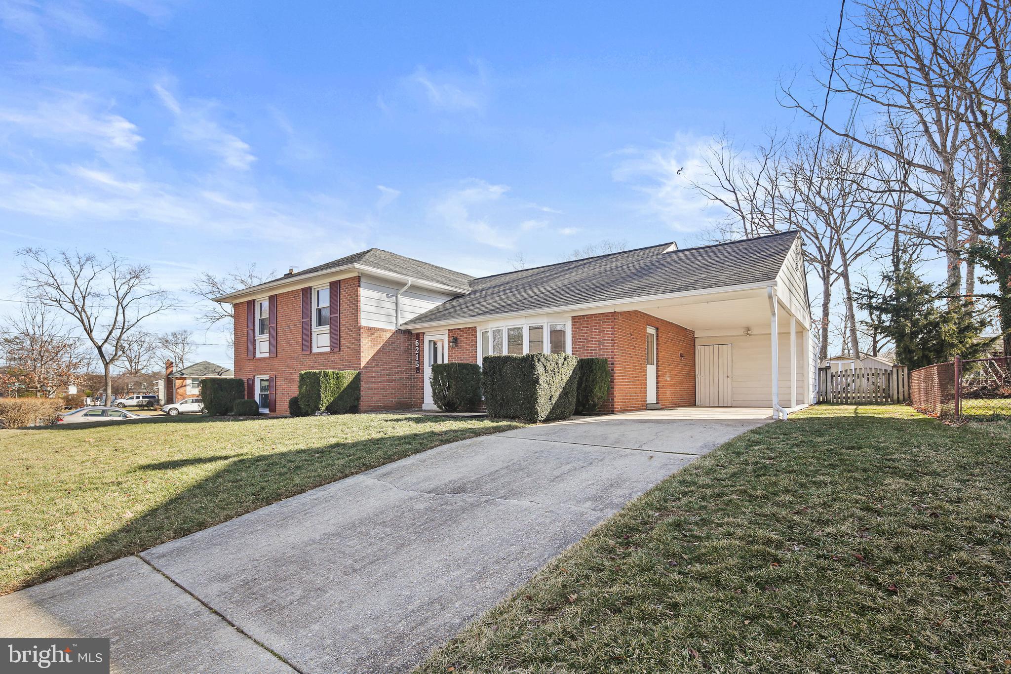 6215 Roblynn Road Laurel, MD 20707 - Photo 33 of 38 a front view of a house with a yard