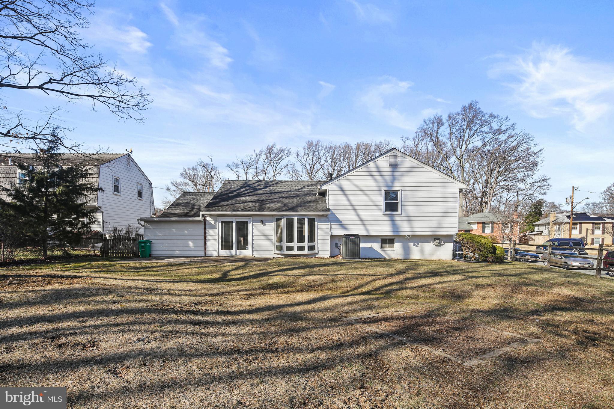 6215 Roblynn Road Laurel, MD 20707 - Photo 38 of 38 a view of a house with a big yard and large trees