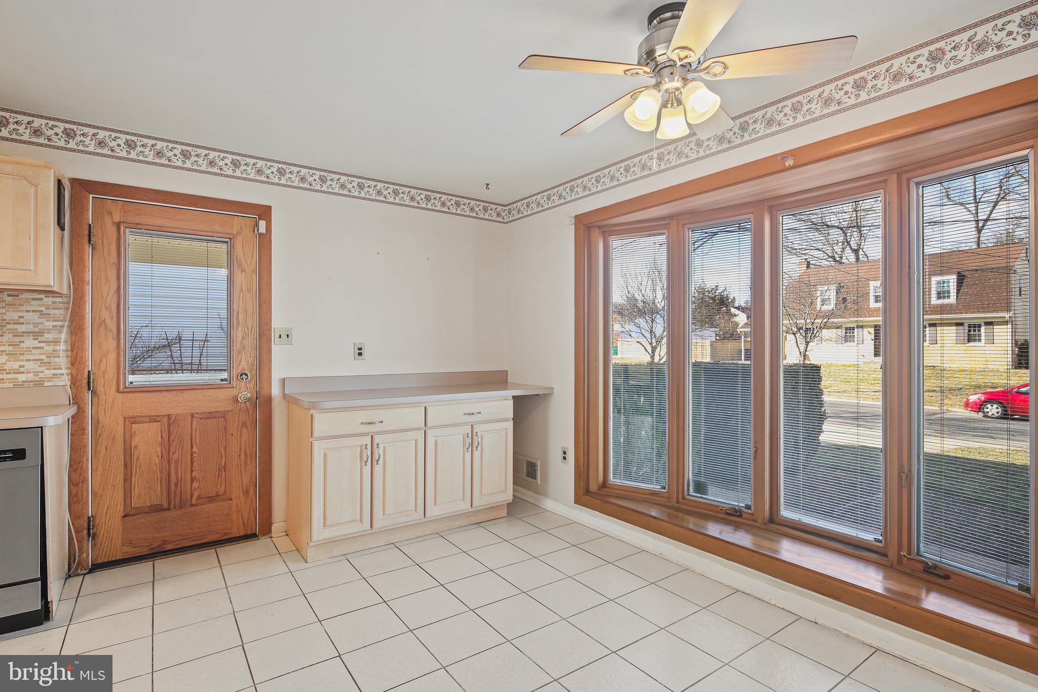 6215 Roblynn Road Laurel, MD 20707 - Photo 5 of 38 a spacious bathroom with a granite countertop sink and a mirror