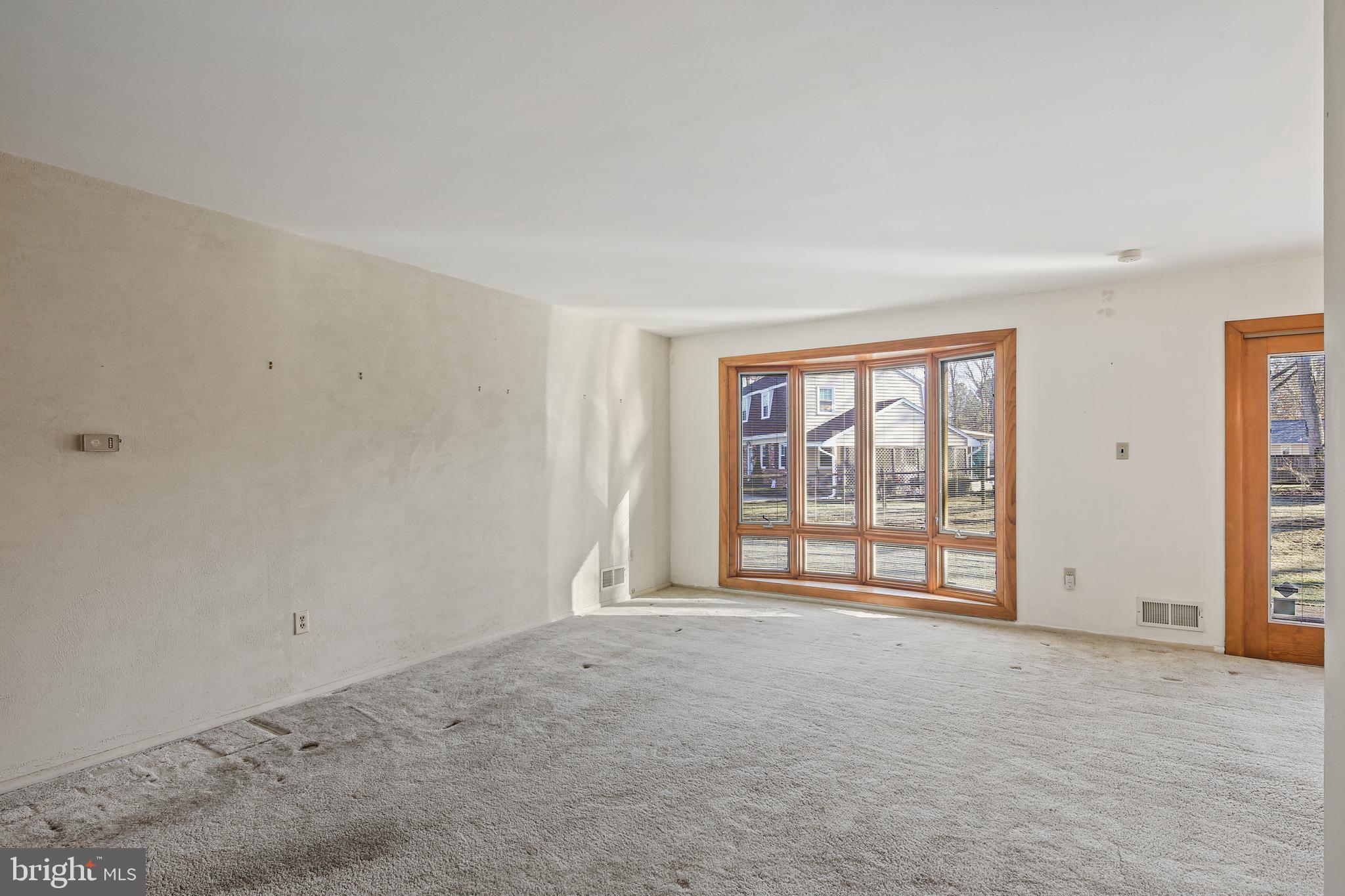 6215 Roblynn Road Laurel, MD 20707 - Photo 8 of 38 a view of an empty room with a window