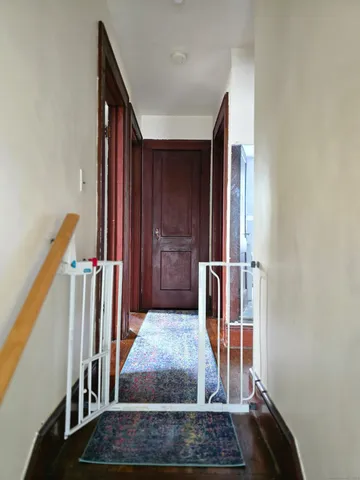 a bed room with a bed and a chair