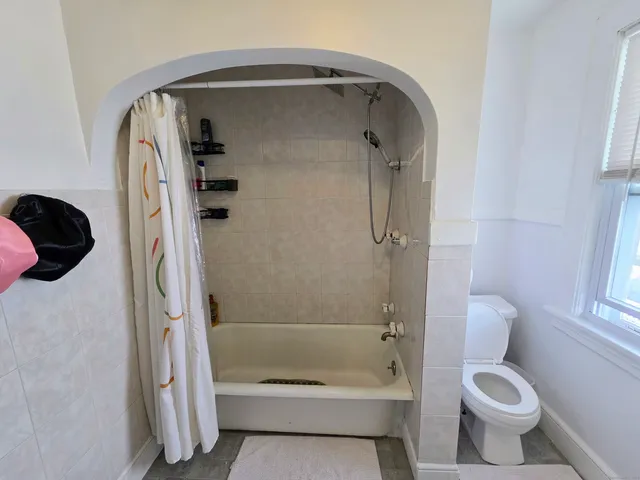 a bathroom with a bathtub and a sink
