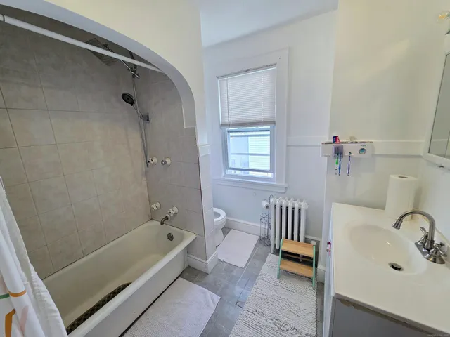 a bedroom with a bed and furniture