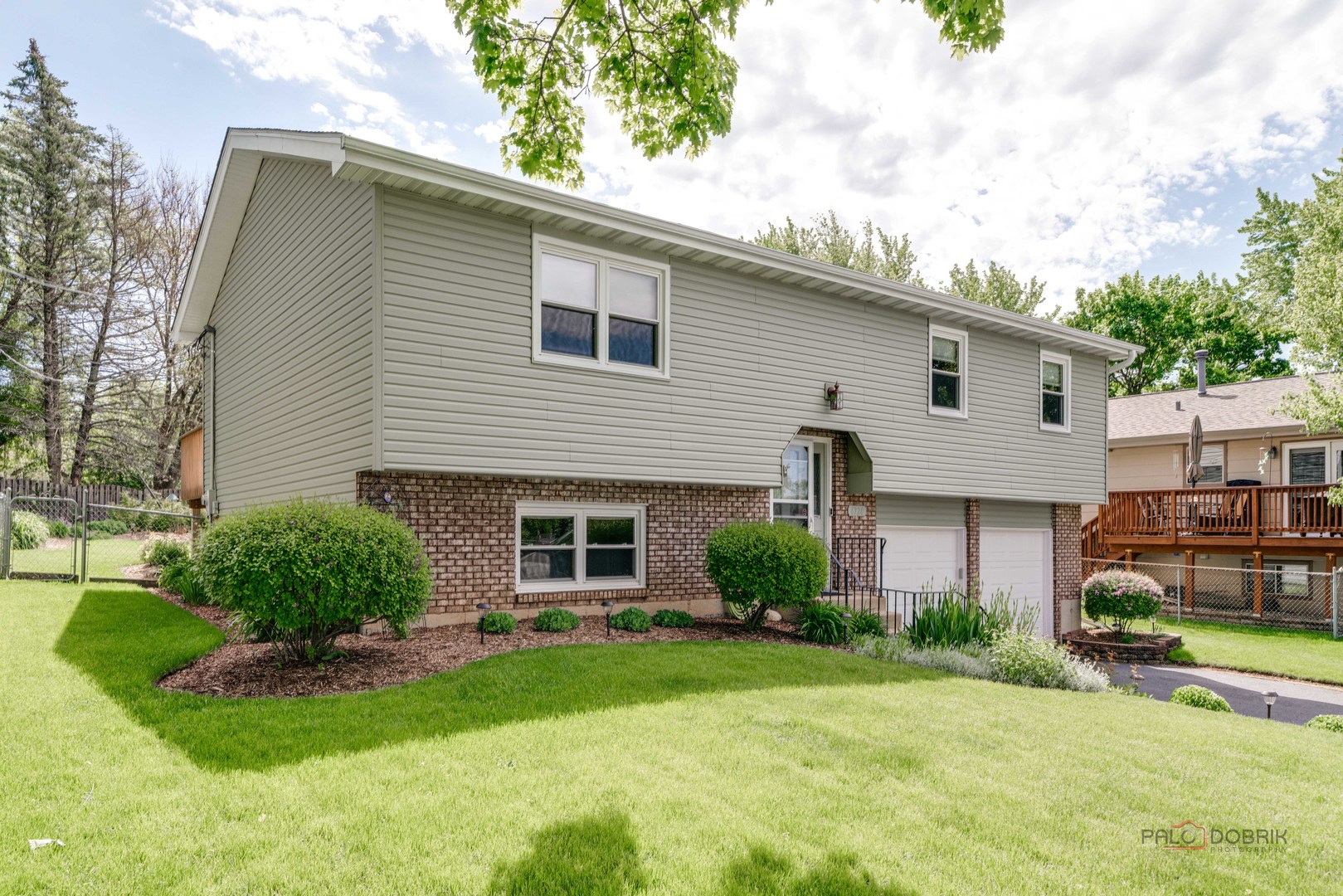 6720 Hunters Path Cary, IL 60013 - Photo 2 of 33 a front view of a house with a yard