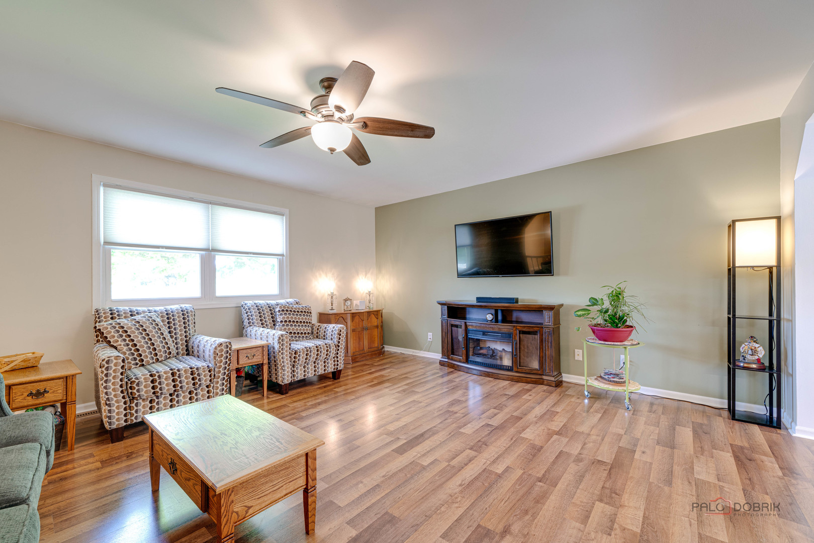 6720 Hunters Path Cary, IL 60013 - Photo 5 of 33 a living room with furniture and a flat screen tv