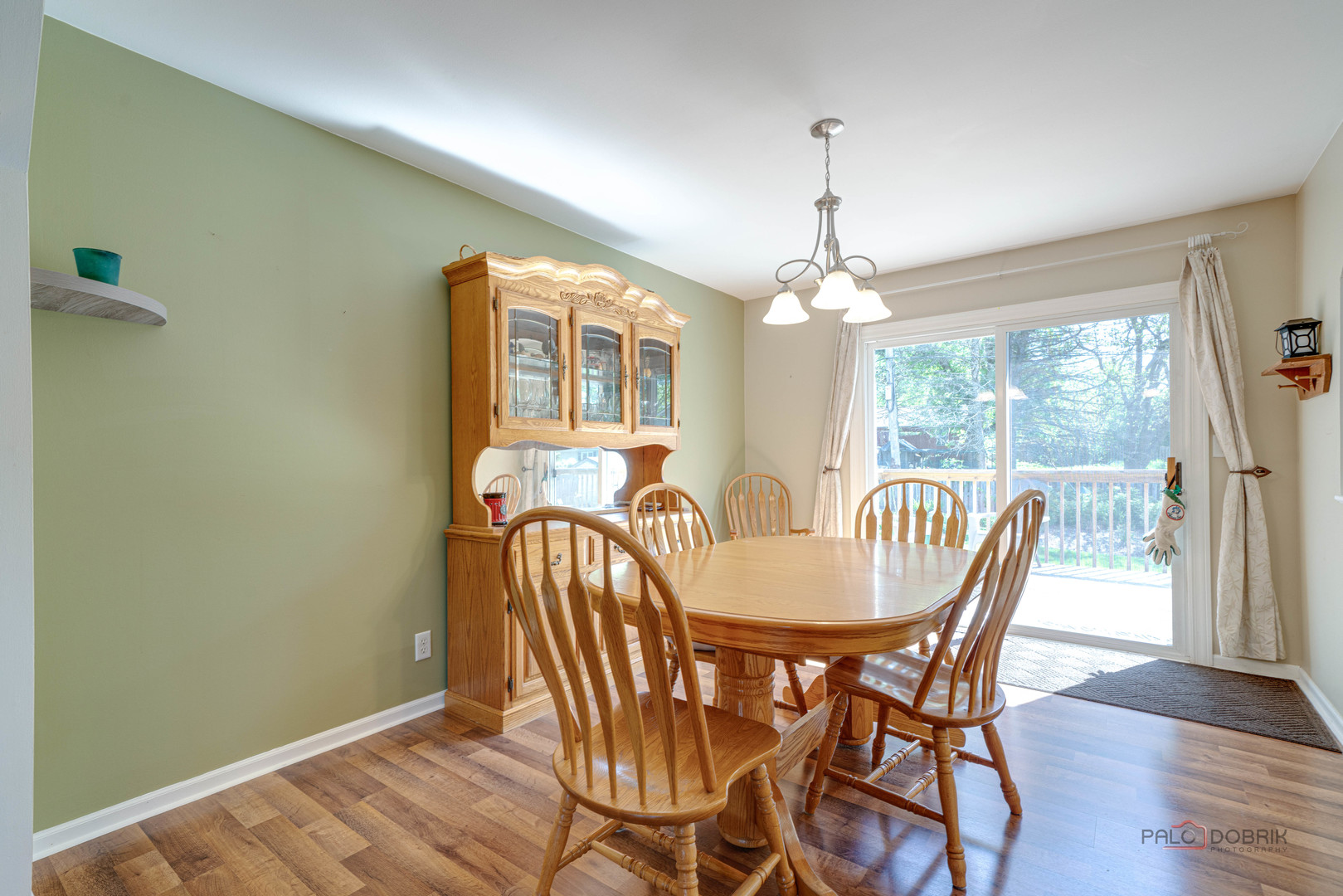 6720 Hunters Path Cary, IL 60013 - Photo 8 of 33 a view of a dining room with furniture window and wooden floor